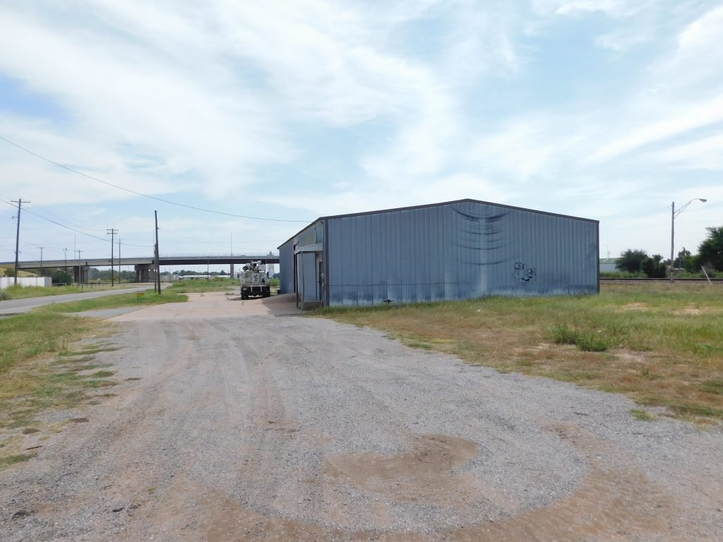 9/29 SHOP BUILDING * .7 +/- ACRES * COMMERCIAL PROPERTY * ENID, OKLAHOMA 4, 750 SQ.FT. OF SHOP AREA * BLACKTOP FRONTAGE