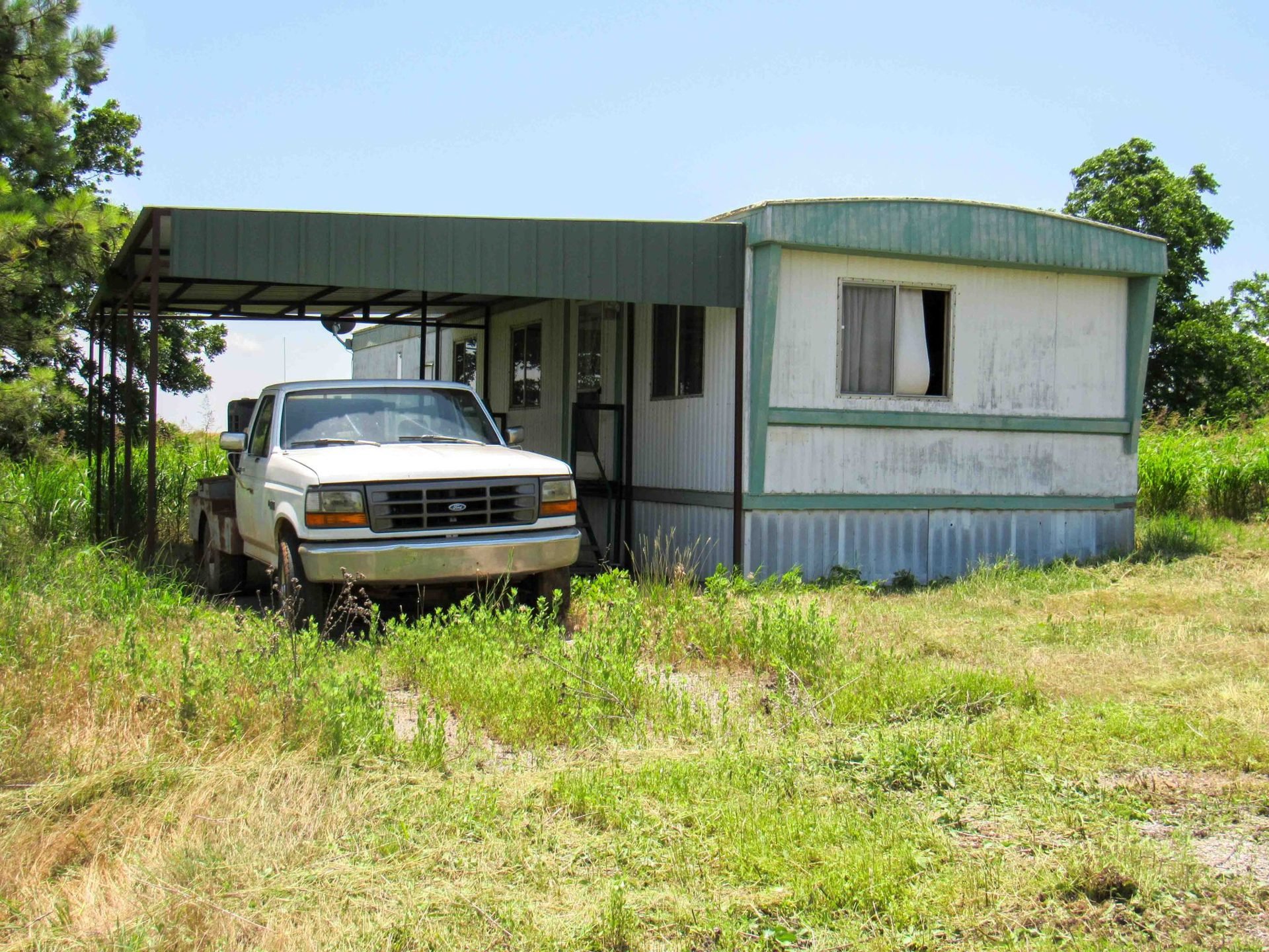 7/8 2± ACRE HOME SITE * 30’X40’ SHOP * STORAGE BUILDINGS * COCA-COLA MEMORABILIA * SHOP TOOLS * ENID OKLAHOMA