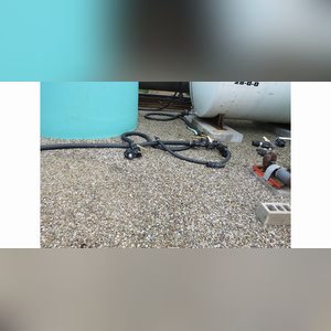 Several flat-bottom poly tanks, 1,550, 2,500 & 6,000 gal.