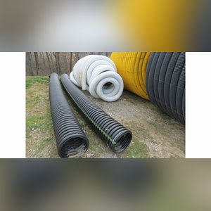 Roll of 4â? & 6â? perforated tile & misc. sticks of tile