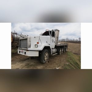 Volvo GM HD truck, tandem-axle w/ 2 cheaters, 24â?? Eby alum. flatbed & side racks, (Wrecked, for parts)