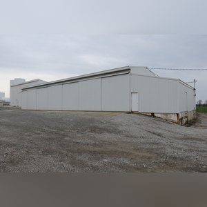 This 42â??x58â?? building is attached to the west end of Building B. It includes a small office area, concrete floor, (2) 15â??x17â?? sliders, walk-in door, and 220 amp single-phase & 3-phase electric.