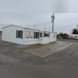 This office building with nearly 1,100 sq. ft. and a full, poured-wall basement, has a natural gas air-forced furnace and central air. This building offers a very nice floor plan which includes 10â??x10â??, 15â??x8â??, and 12â??x7â?? offices, a 12â??x6â?? file room, a large lobby area, and a restroom. In addition, the 9.5â??x60â?? in-ground truck scale with a 120,000 lb. capacity is located immediately in front of this building complete with a UMC 465 digital scale display.