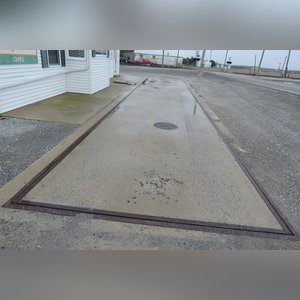 This office building with nearly 1,100 sq. ft. and a full, poured-wall basement, has a natural gas air-forced furnace and central air. This building offers a very nice floor plan which includes 10â??x10â??, 15â??x8â??, and 12â??x7â?? offices, a 12â??x6â?? file room, a large lobby area, and a restroom. In addition, the 9.5â??x60â?? in-ground truck scale with a 120,000 lb. capacity is located immediately in front of this building complete with a UMC 465 digital scale display.