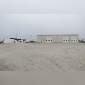 Great location just off of US-33. Large, stone lot with easy access off of Bay Road. 50â??x50â?? concrete-walled containment area. Lots of outdoor security lighting. 4â? well and private septic system