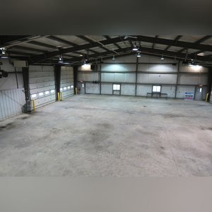 This steel-framed, completely insulated building boasts many custom features making it ideal for multiple purposes. It includes (3) office areas with built-in work surfaces, air conditioning, and LP gas forced-air heat. (2 offices are 12â??x11â?? & the other is 19â??x11â??.) The garage/shop area is 75â??x100â?? with concrete floors & approaches, (6) 16â??x16â?? overhead doors with openers, (4) walk-in doors, and loft storage area above offices. Additional amenities include (2) Reznor LP heaters, Energylogic waste oil furnace, ventilation system with louvered panels, ceiling fans, multiple electrical panels with 220 amp service, several outdoor electrical outlets with pigtail cords to plug in tractors, semis, etc., and a 10 HP 2-stage NAPA air compressor.