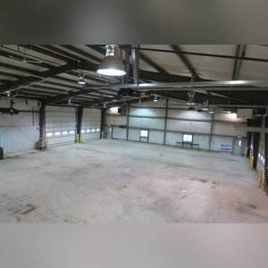 This steel-framed, completely insulated building boasts many custom features making it ideal for multiple purposes. It includes (3) office areas with built-in work surfaces, air conditioning, and LP gas forced-air heat. (2 offices are 12â??x11â?? & the other is 19â??x11â??.) The garage/shop area is 75â??x100â?? with concrete floors & approaches, (6) 16â??x16â?? overhead doors with openers, (4) walk-in doors, and loft storage area above offices. Additional amenities include (2) Reznor LP heaters, Energylogic waste oil furnace, ventilation system with louvered panels, ceiling fans, multiple electrical panels with 220 amp service, several outdoor electrical outlets with pigtail cords to plug in tractors, semis, etc., and a 10 HP 2-stage NAPA air compressor.