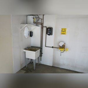 This steel-framed, completely insulated building boasts many custom features making it ideal for multiple purposes. It includes (3) office areas with built-in work surfaces, air conditioning, and LP gas forced-air heat. (2 offices are 12â??x11â?? & the other is 19â??x11â??.) The garage/shop area is 75â??x100â?? with concrete floors & approaches, (6) 16â??x16â?? overhead doors with openers, (4) walk-in doors, and loft storage area above offices. Additional amenities include (2) Reznor LP heaters, Energylogic waste oil furnace, ventilation system with louvered panels, ceiling fans, multiple electrical panels with 220 amp service, several outdoor electrical outlets with pigtail cords to plug in tractors, semis, etc., and a 10 HP 2-stage NAPA air compressor.