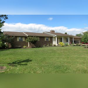 10± acres, home, pole barn, shop building, fenced pastures, and pond. The impressive interior of the home boasts 4 bedrooms and 3 full baths. The master suite is 16â??x16â?? with a large walk-in closet. The master bath has a double sink and a large custom shower. The 22â??x14â?? eat-in kitchen has custom cabinets, granite counter tops, and a brick-front raised fireplace. The large main level also includes the 20â??x14â?? living room with fireplace, 18â??x16â?? family room, 14â??x12â?? office area, mud room, and laundry room. This spacious main level floor plan is ideal for the family as well as entertaining. The full basement is partially finished, and the 2-car attached garage includes a large storage area. Other amenities within the home include a Lennox LP gas forced-air furnace, central air, Pella windows, a newer roof, cathedral ceilings, ceramic tile and wood flooring, ceiling fans, and a Radionon system. The exterior is beautifully landscaped with mature trees, colorful perennials, a small orchard and grape vineyard, a large play area, and a ½ acre stocked pond. The 60â??x50â?? pole barn with walk-in door and 14â??-high end slider includes grooved concrete, maternity pens, custom Gingway gates, a working chute, and 4 individual turn-out pens. There are 6 fenced and cross-fenced pasture areas, each with its own Ritchie waterer. The 34â??x32â?? shop building has a concrete floor, porch, and walk-in and overhead doors.